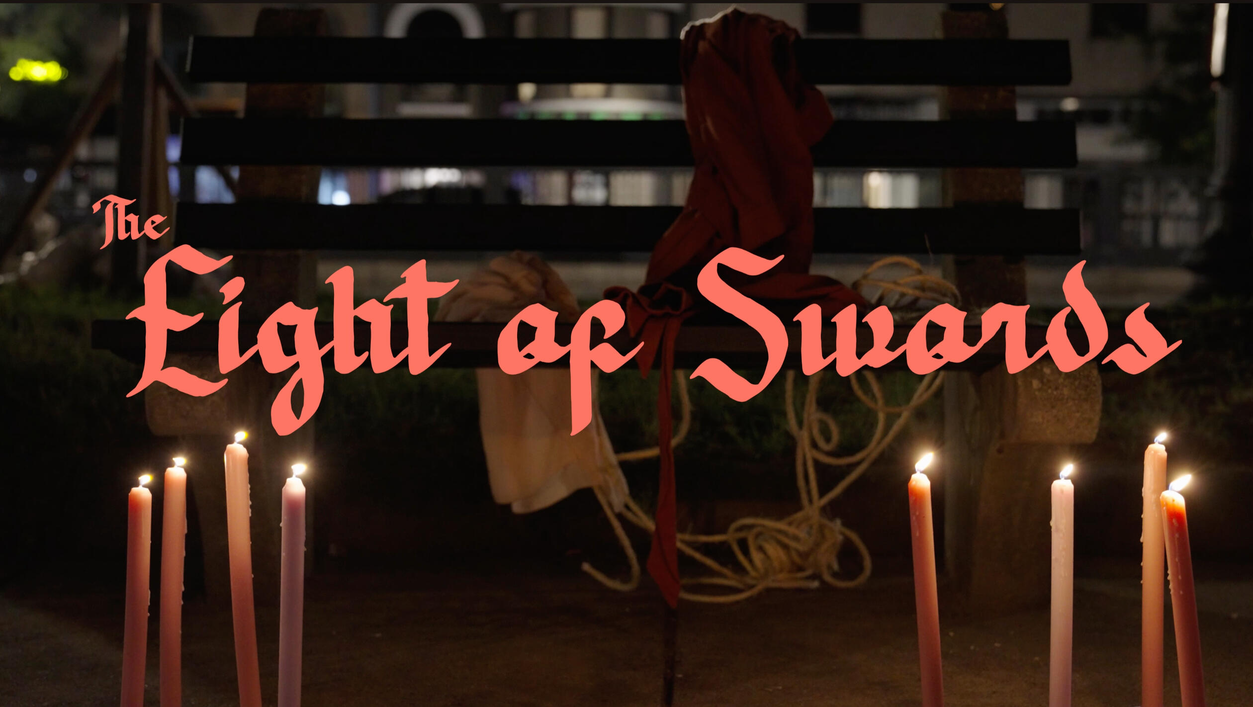 The Eight of Swords title card A title card reading "The Eight of Swords" in a gothic font. Below it, eight candle sticks are lit, with wax dripping down them. Behind the text is a park bench with a piece of cloth and rope draped over it.
